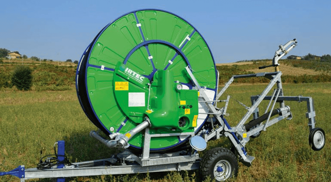 Hard hose irrigator watering agricultural crop