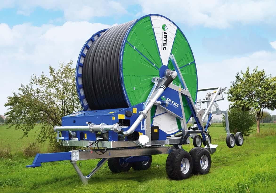 Hard hose irrigator watering agricultural crop
